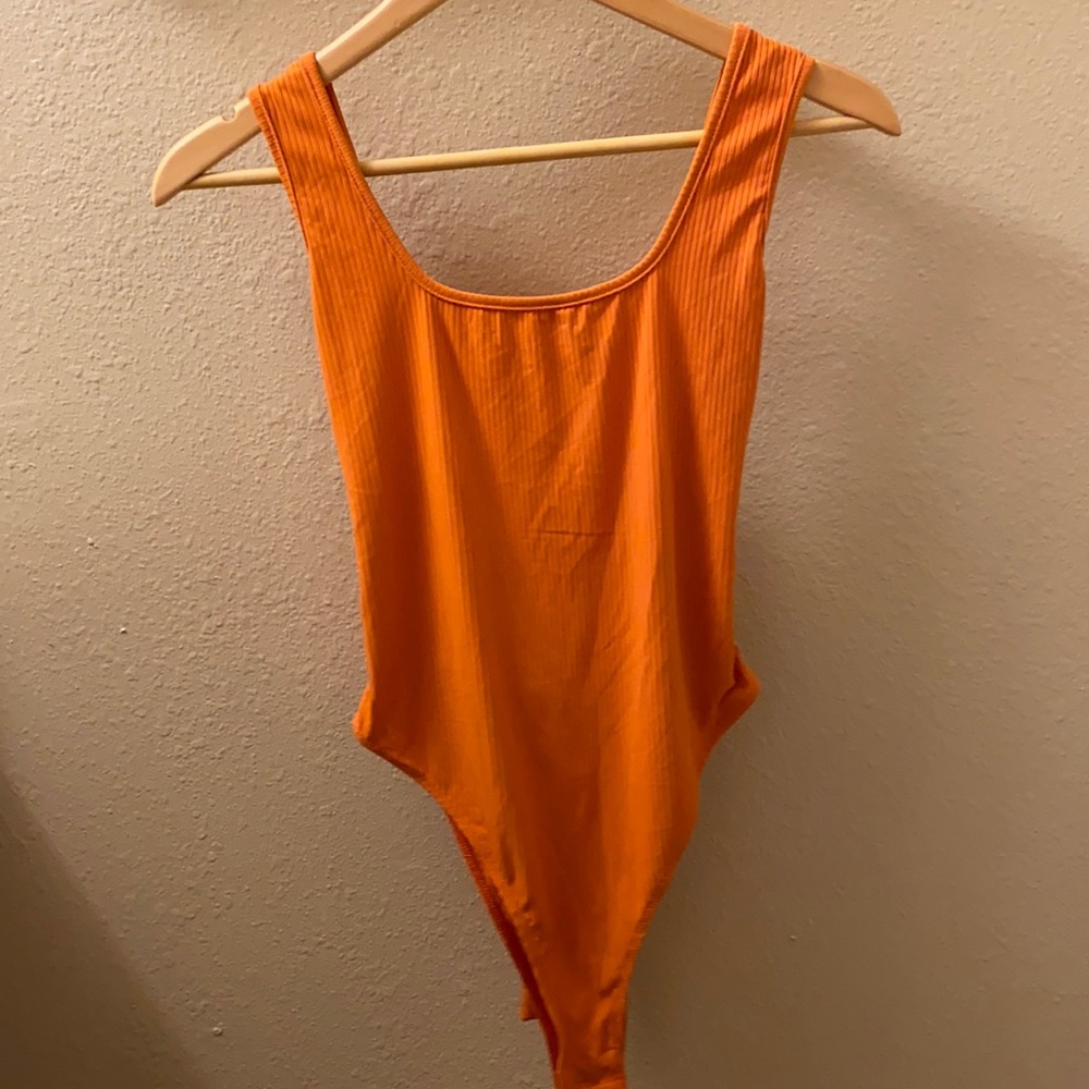 Adorable orange bodysuit!